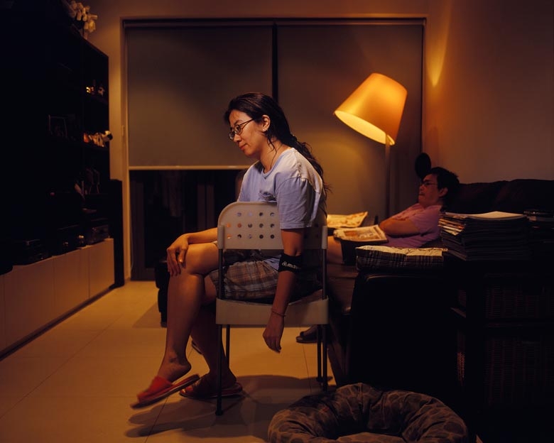 Magdelene sits in her living room in Kai Yuen Street, North Point.